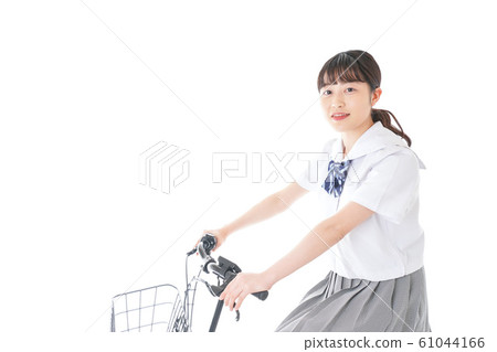 Young girl student going to school by bicycle Young girl student going to school by bicycle 61044166