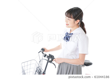 Young girl student going to school by bicycle Young girl student going to school by bicycle 61044186
