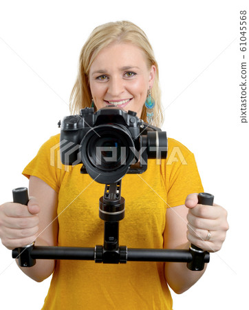 woman videographer using steady cam, on white 61045568