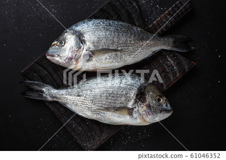 Fresh dorado fish with ingredients 61046352