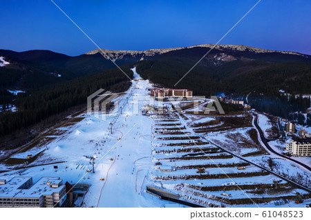 Yaremche. Ukraine. 6 March 2018. Bukovel. Aerial view of the mountains. Carpathians. Winter. Snow. Yaremche. Ukraine. 6 March 2018. Bukovel. Aerial view of the mountains. Carpathians. Winter. Snow. 61048523
