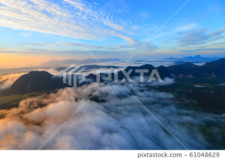 Landscape with sea of clouds in Vang Vieng, Laos Landscape with sea of clouds in Vang Vieng, Laos 61048629