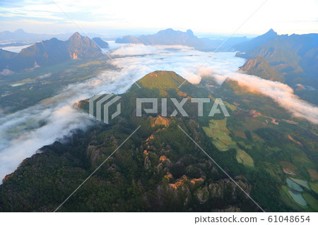 Landscape with sea of clouds in Vang Vieng, Laos Landscape with sea of clouds in Vang Vieng, Laos 61048654