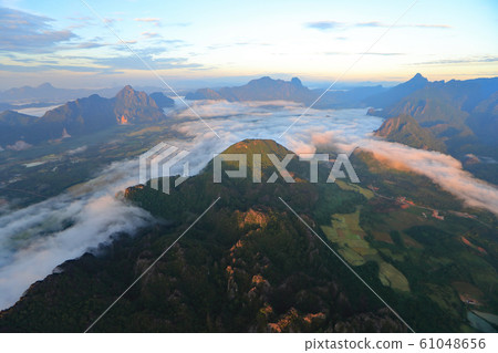 Landscape with sea of clouds in Vang Vieng, Laos Landscape with sea of clouds in Vang Vieng, Laos 61048656