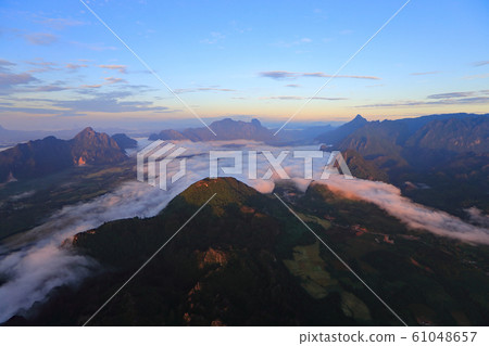 Landscape with sea of clouds in Vang Vieng, Laos Landscape with sea of clouds in Vang Vieng, Laos 61048657