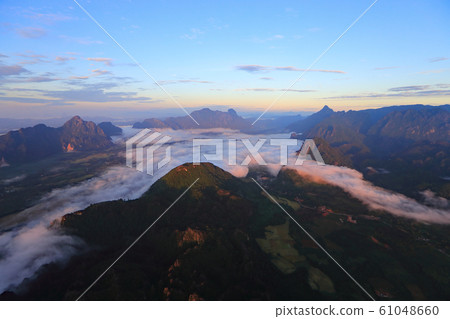 Landscape with sea of clouds in Vang Vieng, Laos Landscape with sea of clouds in Vang Vieng, Laos 61048660