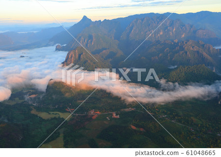 Landscape with sea of clouds in Vang Vieng, Laos Landscape with sea of clouds in Vang Vieng, Laos 61048665