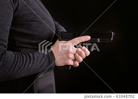 Close up of a gun in a hand 61048702