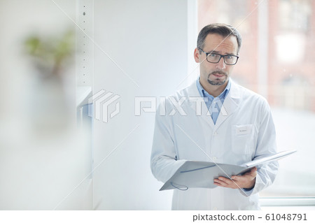 Doctor filling the medical card 61048791