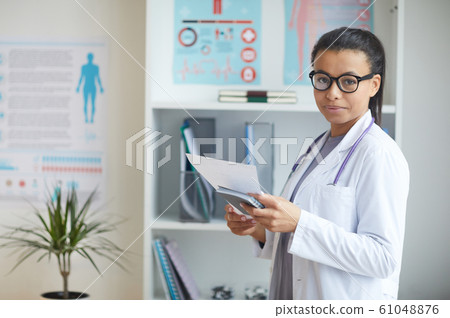 Female doctor working at office Female doctor working at office 61048876