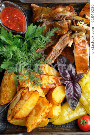 Barbecue on the bones with vegetables and potatoes . catering menu Barbecue on the bones with vegetables and potatoes . catering menu 61049286