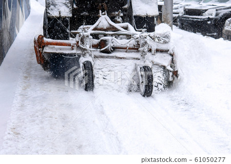 mechanical sweeper brush sweeps snow off the 61050277