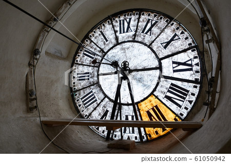 Large clock-face of old mechanical clocks on a tower in a church, inside view Large clock-face of old mechanical clocks on a tower in a church, inside view 61050942