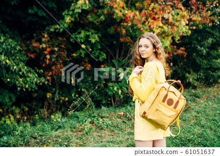 Cheerful smiling teenage girl of 14 years old with long curly red hair Cheerful smiling teenage girl of 14 years old with long curly red hair 61051637