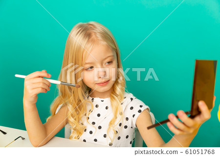 Happy girl at home speaking in front of camera for vlog. Young black woman working as blogger, recording video tutorial for Internet. 61051768