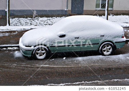 Snow on car after snowfall. Snow on car after snowfall. 61052245