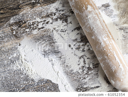 white wheat flour on a wooden table 61052354