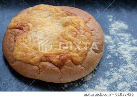 Homemade Flatbread. Fresh Bread crusty on the outside, soft on the inside and loaded with cheese and a hint of salt. 61052426