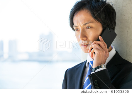 Businessman smartphone call 61055806