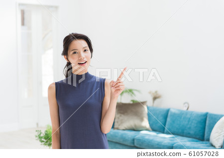 Living room young woman Living room young woman 61057028