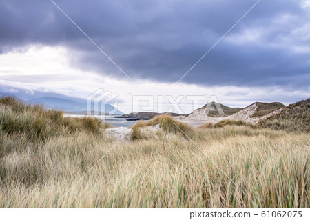Dunes at the Sheskinmore Nature Reserve between Ardara and Portnoo in Donegal - Ireland Dunes at the Sheskinmore Nature Reserve between Ardara and Portnoo in Donegal - Ireland 61062075