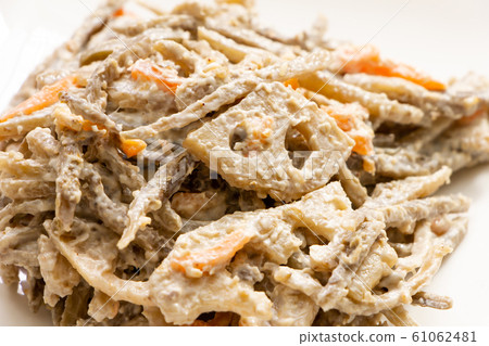 Burdock and lotus root salad. 61062481