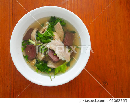 Boiled pig blood, consisting of pork entrails and vegetables named Jing Chu Chai Is another popular breakfast in Thailand. Boiled pig blood, consisting of pork entrails and vegetables named Jing Chu Chai Is another popular breakfast in Thailand. 61062765