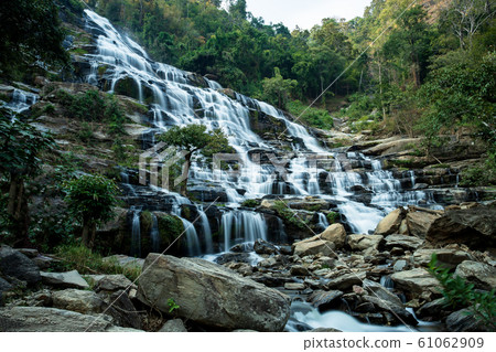 Nature rainforest landscape of Mae Ya Waterfall In Chiang Mai. Nature rainforest landscape of Mae Ya Waterfall In Chiang Mai. 61062909
