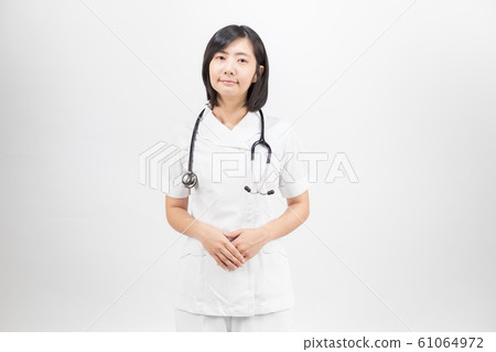 Young asian nurse with a stethoscope isolated over white background. 61064972