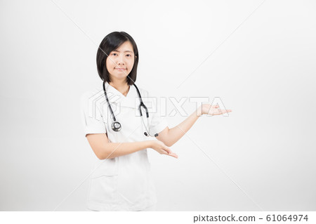 Young asian nurse with a stethoscope isolated over white background. Young asian nurse with a stethoscope isolated over white background. 61064974