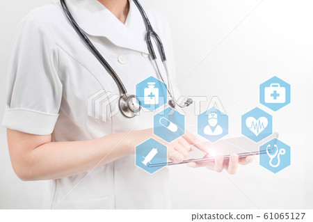 Nurse with a stethoscope in white background. Medical technology concept. Electronic medical record. Nurse with a stethoscope in white background. Medical technology concept. Electronic medical record. 61065127