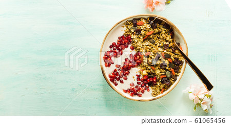 Home made granola bowl with pomegranate 61065456