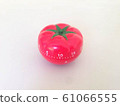 Pomodoro Timer red with green details. Tomato on the table. Vibrant, multi-angle colors. 61066555