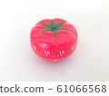Pomodoro Timer red with green details. Tomato on the table. Vibrant, multi-angle colors. 61066568