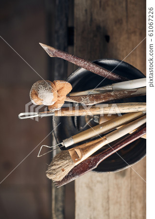 Tools for forming clay on  wooden background.. 61067226