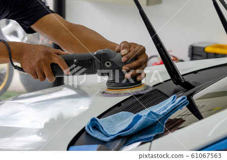 hands holding the work tool polish car. hands holding the work tool polish car. 61067563