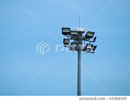 Street Public luminaire with lighting pole against a blue sky background.  61068595