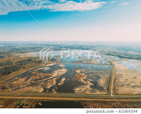 Belarus. Aerial View Of Ponds Autumn Landscape. Ponds of fisheries in the south of Belarus. Top View Of Fish Farms From High Attitude. Drone View. Bird's Eye View 61069394