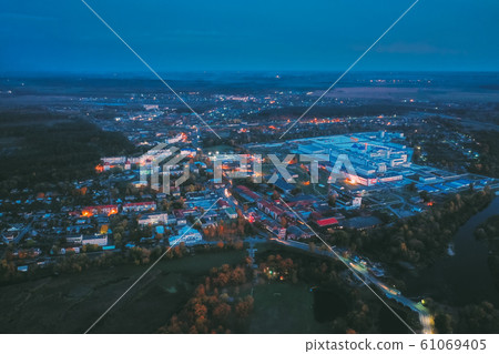 Dobrush, Gomel Region, Belarus. Aerial View Of Old And Modern Paper Factory In Night. Historical Heritage In Bird's-eye View Dobrush, Gomel Region, Belarus. Aerial View Of Old And Modern Paper Factory In Night. Historical Heritage In Bird's-eye View 61069405