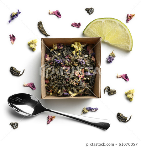 Green tea with natural aromatic additives. Top view on white background Green tea with natural aromatic additives. Top view on white background 61070057