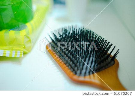 Hairbrush placed on the sink Hairbrush placed on the sink 61070207
