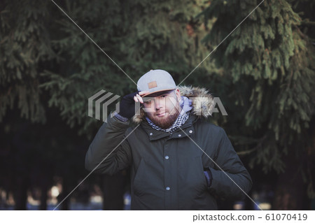 man with a beard in a cap man with a beard in a cap 61070419