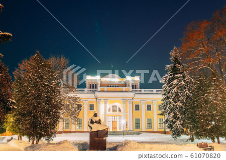 Gomel, Belarus. City Park In Winter Night. Night Starry Sky Above Rumyantsevs And Paskeviches Palace In Homiel Park. Famous Local Landmark In Snow Gomel, Belarus. City Park In Winter Night. Night Starry Sky Above Rumyantsevs And Paskeviches Palace In Homiel Park. Famous Local Landmark In Snow 61070820