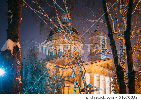 Gomel, Belarus. City Park In Winter Night. Peter And Paul Cathedral In Homiel Rumyantsevs And Paskeviches Park. Famous Local Landmark In Snow. Close Gomel, Belarus. City Park In Winter Night. Peter And Paul Cathedral In Homiel Rumyantsevs And Paskeviches Park. Famous Local Landmark In Snow. Close 61070832