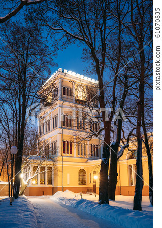 Gomel, Belarus. City Park In Winter Night. Rumyantsevs And Paskeviches Palace In Homiel Park, Belarus. Famous Local Landmark In Snow Gomel, Belarus. City Park In Winter Night. Rumyantsevs And Paskeviches Palace In Homiel Park, Belarus. Famous Local Landmark In Snow 61070835