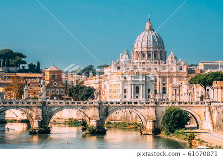 Rome, Italy. Man Training On Kayak Near Aelian Bridge. Papal Basilica Of St. Peter In The Vatican Rome, Italy. Man Training On Kayak Near Aelian Bridge. Papal Basilica Of St. Peter In The Vatican 61070871