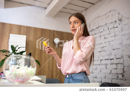 Shop administrator providing payment requisites to the client Shop administrator providing payment requisites to the client 61070997