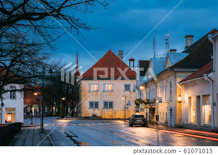Kuressaare, Estonia. Building Of Noble Assembly And Kuressaare Town Hall At Lossi Street In Evening Or Night Illuminations 61071015