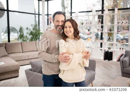 Wife and husband feeling good in furniture salon Wife and husband feeling good in furniture salon 61071206