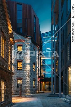 Tallinn, Estonia. Historical Rotermann City Quarter In Evening Illuminations. Rotermann Quarter Includes Old Industrial Buildings With New Function And Modern Architecture Tallinn, Estonia. Historical Rotermann City Quarter In Evening Illuminations. Rotermann Quarter Includes Old Industrial Buildings With New Function And Modern Architecture 61071952